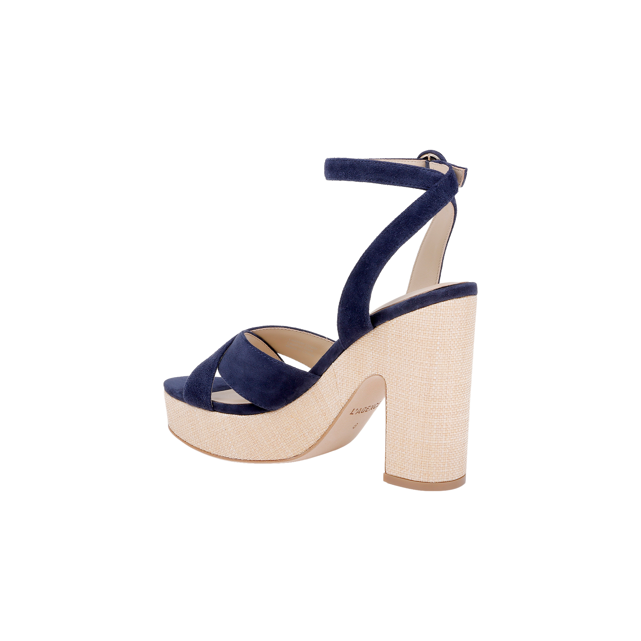 Introducing the Sandrine Platform Sandal: a chic footwear choice featuring a thick beige heel and platform, complemented by navy blue suede crisscross straps and an adjustable ankle strap with buckle. Set against a white background, this modern design is inspired by the look of a raffia-wrapped wedge, offering unique textural appeal.