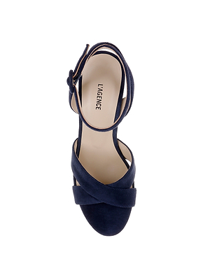A top view of the Sandrine Platform Sandal in navy suede, showcasing crisscross straps and an ankle strap with LAGENCE on the insole, photographed on a white background.
