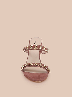 Front view of the Sarika Chain Sandal in mauve, featuring two gold chain-accented straps and an open toe, displayed on a light beige background.