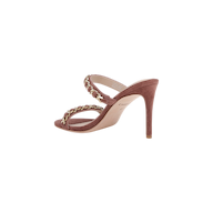 Introducing the Sarika Chain Sandal—a high-fashion mauve suede sandal featuring two straps across the foot, each embellished with elegant gold chain hardware. This stylish sandal is designed with an open toe and a sleek stiletto heel.