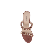 The Sarika Chain Sandal is a brown high-fashion sandal featuring two gold chain hardware-accented straps and a flat sole, viewed from above. The insole displays “LAGENCE” in black text.