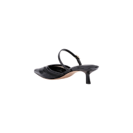 The Shelbie Kitten-Heel Mule in black showcases a pointed toe, thin ankle strap, v-cut vamp, and mid-height stiletto heel in a slingback style, presented from a rear angle against a plain white background.