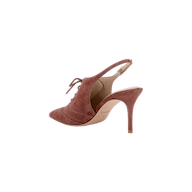 The Shreya Suede Slingback Pump is shown on a white background, featuring a single mauve high heel with a pointed toe, lace-up front, and suede upper.