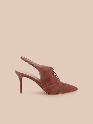 The Shreya Suede Slingback Pump features a pinkish-brown suede upper, pointed toe, lace-up front, cutout sides, and decorative perforations, shown on a solid beige background.