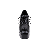 Front view of the Tania Oxford Pump in black, showcasing a lace-up design with a block heel and platform sole, featuring both glossy and matte finishes, set against a plain white background.