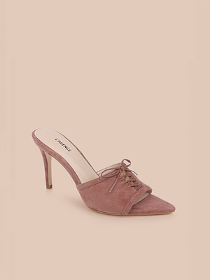 The Thames Suede Sandal, a mauve mule with a pointed toe, stiletto heel, lace-up front, and open back, is displayed on a light beige background.
