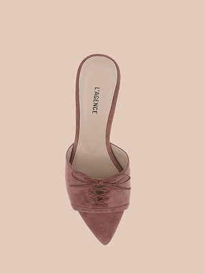 A single Thames Suede Sandal in mauve with a pointed toe, decorative laces, stiletto heel, and L’AGENCE branding on the insole is displayed against a light beige background.