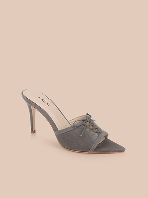 The Thames Suede Sandal is a single grey mule with a pointed toe, thin stiletto heel, memory foam insole, and front laces, shown against a light peach background.
