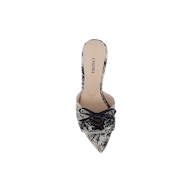 The Thames Sandal is a pointed-toe slip-on mule, adorned with black lace detailing and a small bow on the front. It features an elegant touch of jungle brocade, while the beige insole showcases the LAGENCE brand name.