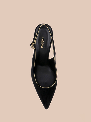 The Vichy Slingback Pump is a black stiletto with gold piping and a buckle, shown from above on a beige background. The insole features the LAGENCE label.