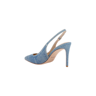 The Vichy Slingback Pump is a stiletto with a pointed toe, crafted in light blue denim fabric and featuring a tan sole, displayed in side profile against a white background.