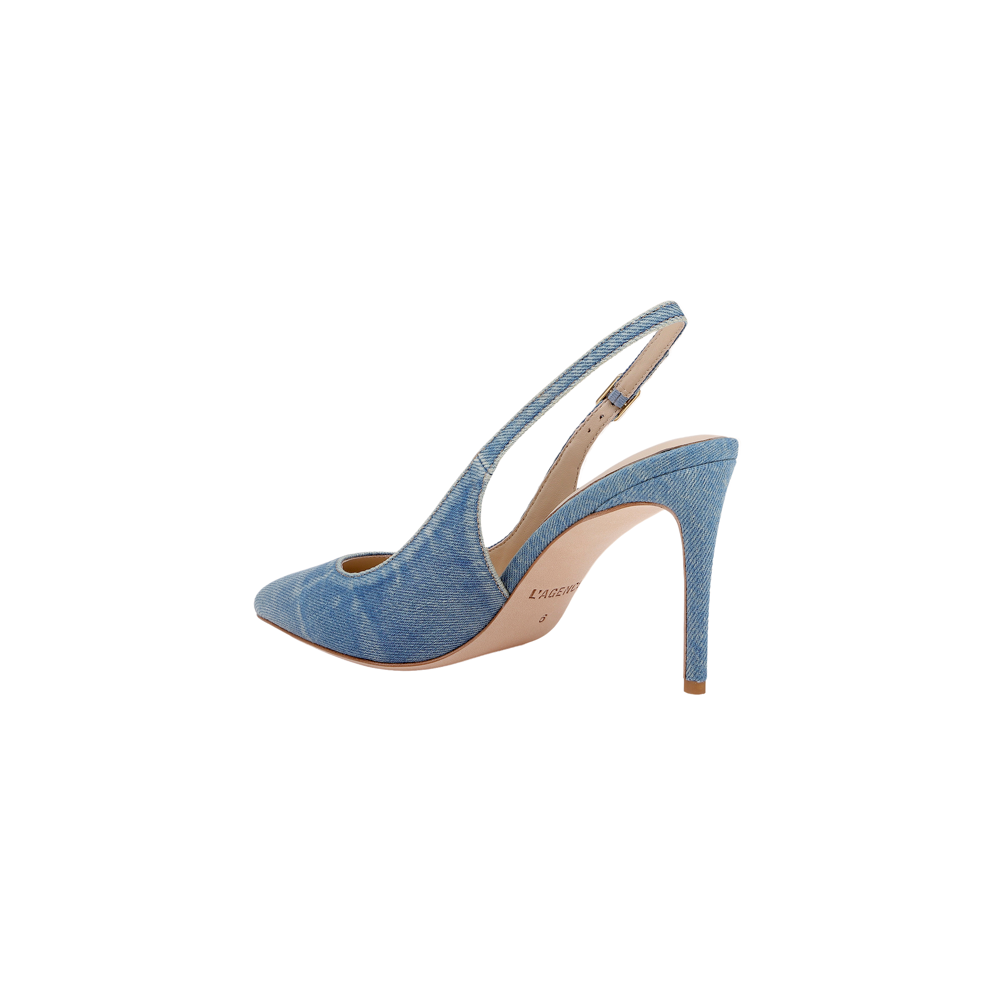 The Vichy Slingback Pump is a stiletto with a pointed toe, crafted in light blue denim fabric and featuring a tan sole, displayed in side profile against a white background.