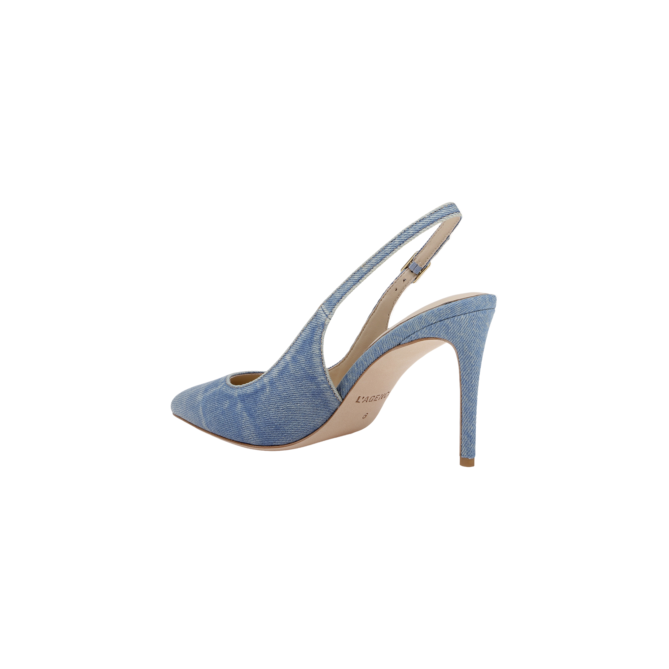 The Vichy Slingback Pump is a stiletto with a pointed toe, crafted in light blue denim fabric and featuring a tan sole, displayed in side profile against a white background.