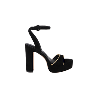The Essie Platform Sandal is a black suede heeled sandal with a thick ankle strap and buckle, featuring a single toe strap adorned with a gold accent and set on a chunky platform heel. This stylish sandal is showcased against a plain white background.