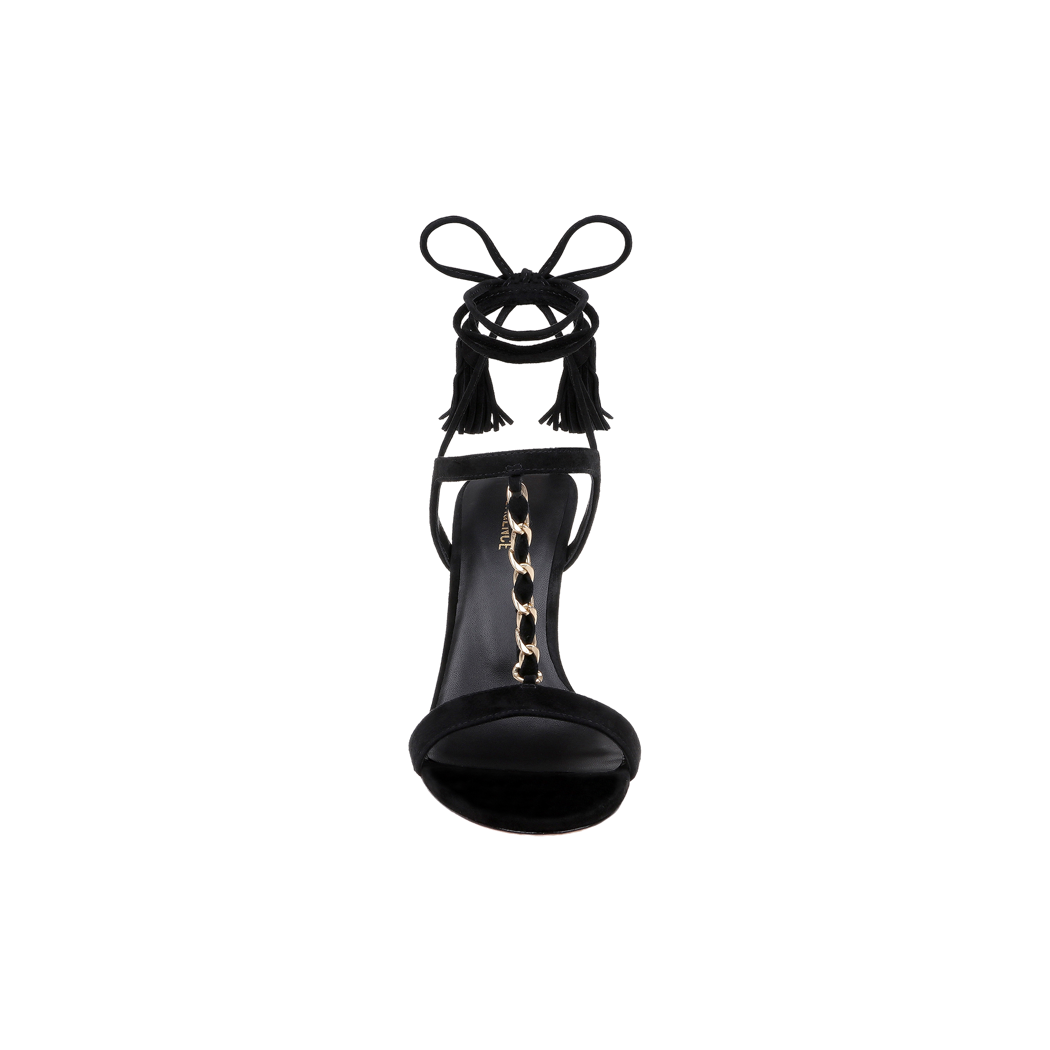 Front view of the Bond Suede Sandal in black, showcasing strappy heels with an ankle wrap featuring tassel accents and a gold chain detail along the insole, displayed against a white background.