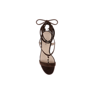 A single Bond Suede Sandal in dark brown is shown from above, highlighting its open toe, ankle strap, and bow-tied laces. This strappy heel showcases a minimalist, elegant design against a plain white background.
