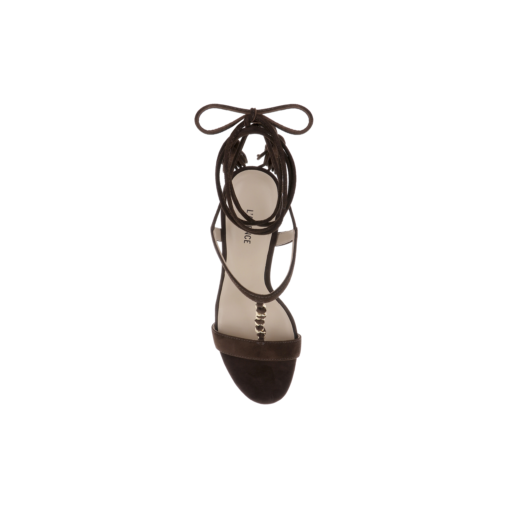 A single Bond Suede Sandal in dark brown is shown from above, highlighting its open toe, ankle strap, and bow-tied laces. This strappy heel showcases a minimalist, elegant design against a plain white background.