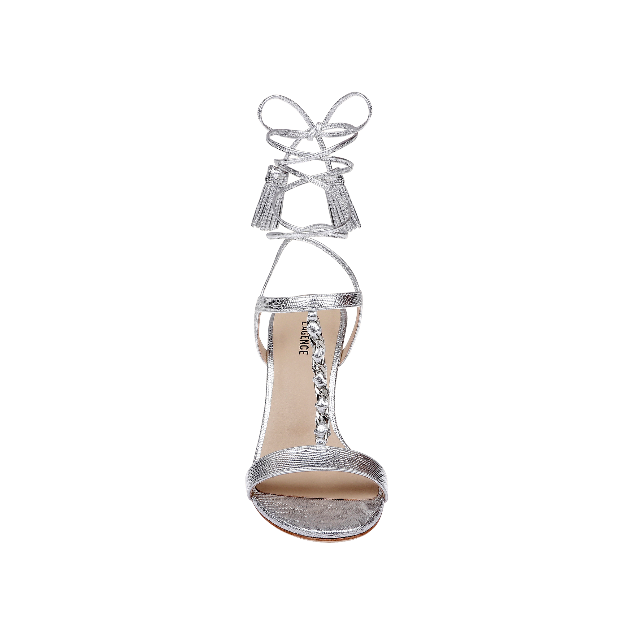 Bond Leather Sandal in silver leather, featuring a high heel and ankle wrap laces with tassel ends, designed with strappy details and gemstone embellishments along the T-strap, shown from above on a white background.