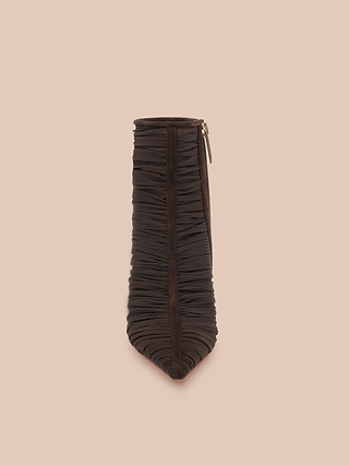 The Fulton Mesh Bootie, shown from the front against a beige background, features black ruched detailing, a pointed toe, and a visible side zipper reminiscent of a sleek stiletto bootie.
