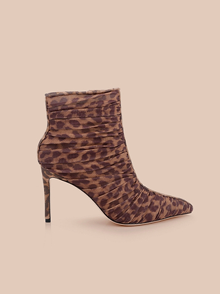 Fulton Mesh Bootie featuring a leopard print, high stiletto heels, pointed toe, and ruched detailing, displayed on a light beige background.
