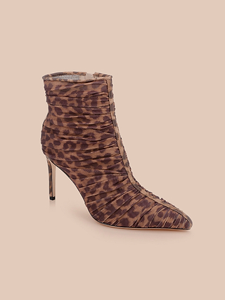 The Fulton Mesh Bootie, featuring a leopard print with ruched detailing, a pointed toe, and a high stiletto heel, is displayed on a plain beige background.