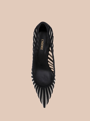A black Lenox Mesh Pump with a pointed toe, mesh upper, and striped sides is shown from above on a beige background. The insole displays the gold LAGENCE logo.