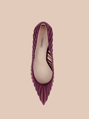 A top-down view of a single pointed-toe, purple Lenox Mesh Pump with ribbed sides and a light beige insole on a plain beige background, exuding the classic elegance of the Lenox design.