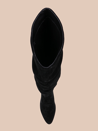 Top view of the Fletcher Boot, a single black suede boot featuring a stylish block heel, set against a light beige background.