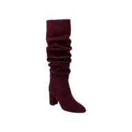The Fletcher Boot, a knee-high slouchy suede boot in rich burgundy with a chunky block heel, exudes bohemian chic style and is displayed on a plain white background.