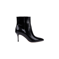 The Houston Bootie, a black leather ankle boot with a pointed toe and high stiletto heel, is displayed in profile against a plain white background.