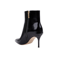 The Houston Bootie is a black leather ankle bootie featuring a pointed toe, side zipper, and stiletto heel, shown against a white background.