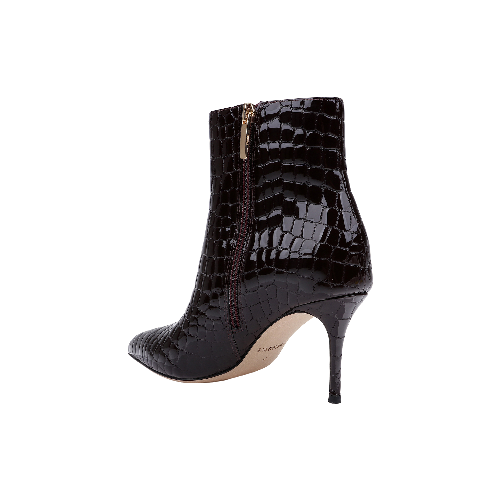 The Houston Bootie is a black, high-heeled ankle bootie with a pointed toe and faux crocodile texture, featuring a side zipper and slender stiletto heel, shown on a white background.