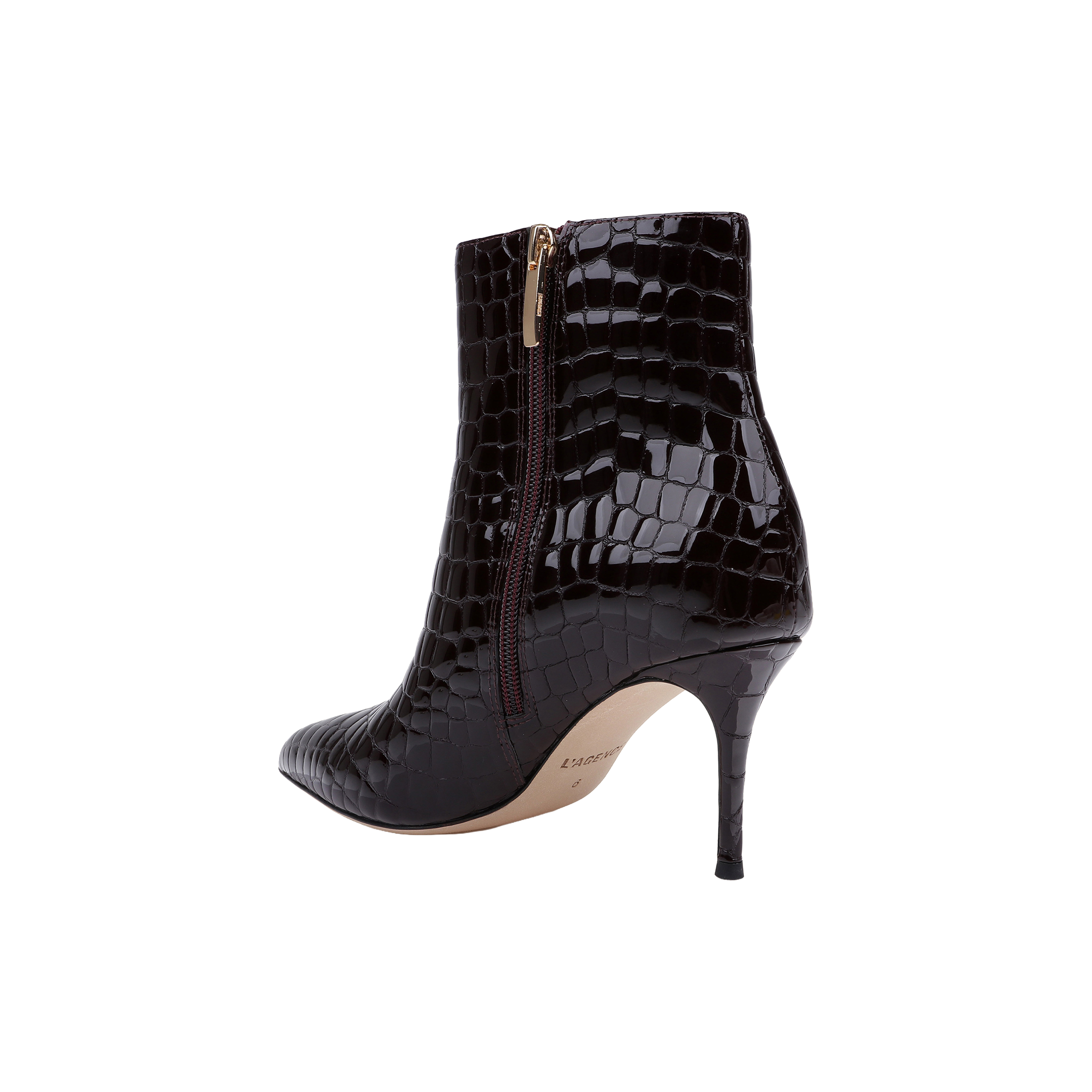 The Houston Bootie is a black, high-heeled ankle bootie with a pointed toe and faux crocodile texture, featuring a side zipper and slender stiletto heel, shown on a white background.