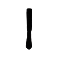 The Herald Boot, a single black suede knee-high boot featuring a pointed toe, stiletto heel, and a side zipper, is displayed upright against a plain white background.