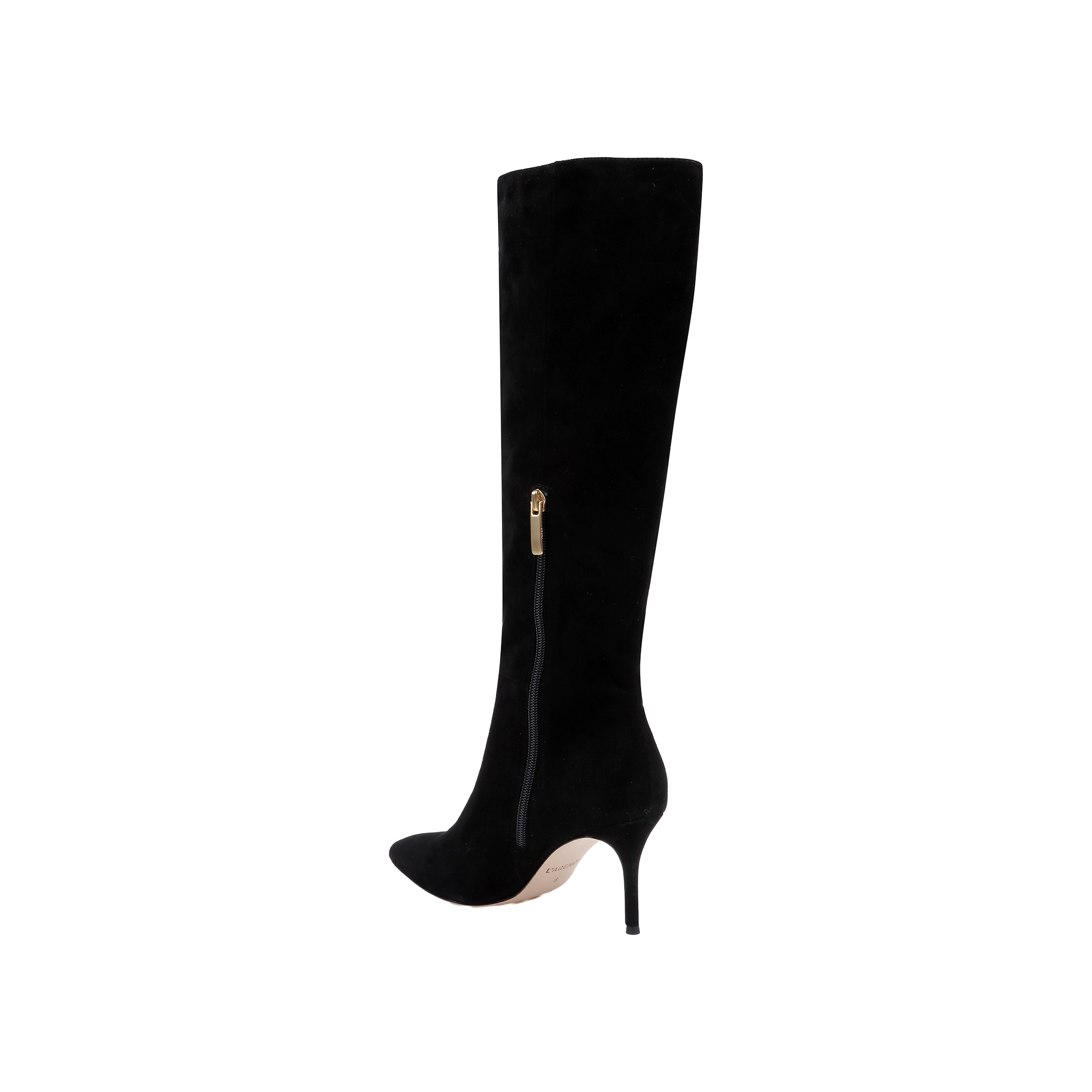 The Herald Boot is a black suede, knee-high boot featuring a pointed toe, stiletto heel, and a gold side zipper. Displayed against a plain white background, this boot highlights its sleek and elegant design.