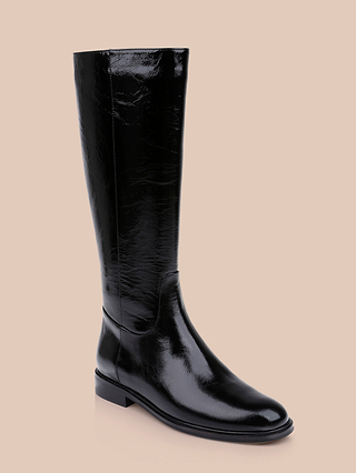 A single shiny black Cortland Boot, a knee-high riding style with a low heel, is displayed on a plain beige background.