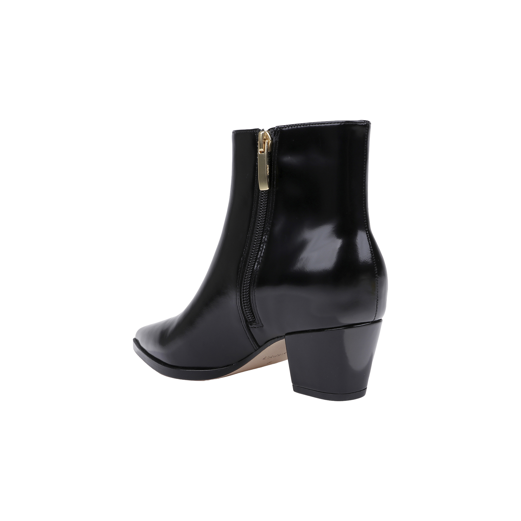 The Vesey Bootie, crafted in black leather with a shiny finish, features a pointed toe, side zipper, and a mid-height block heel, shown against a white background.