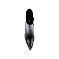 Top view of a single Vesey Bootie in black leather with a shiny, pointed toe and side zipper, featuring the brand name CHARLES  KEITH on the insole, set against a plain white background.