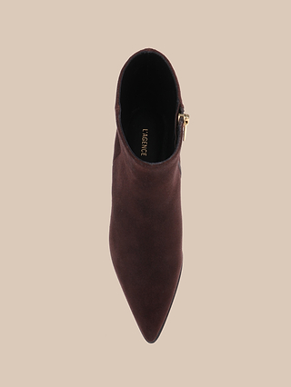Top view of the Vesey Bootie in mahogany suede, featuring a pointed toe and side zipper, displayed on a beige background. The insole is detailed with gold lettering.