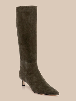 The Baxter Boot is a tall, ash olive green suede knee-high boot featuring a pointed toe and a low, slim heel, displayed against a plain beige background—an effortlessly stylish choice to elevate any look.