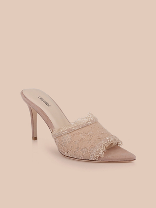 The Penn Mule, showcased on a light beige background, is a beige stiletto heel mule featuring elegant lace detailing, an open toe, and a convenient slip-on design.