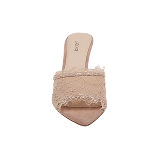 Introducing the Penn Mule: A women’s beige mule featuring a pointed toe and intricate lace detailing across the front, crafted with a luxurious leather lining and showcased from above against a plain white background.