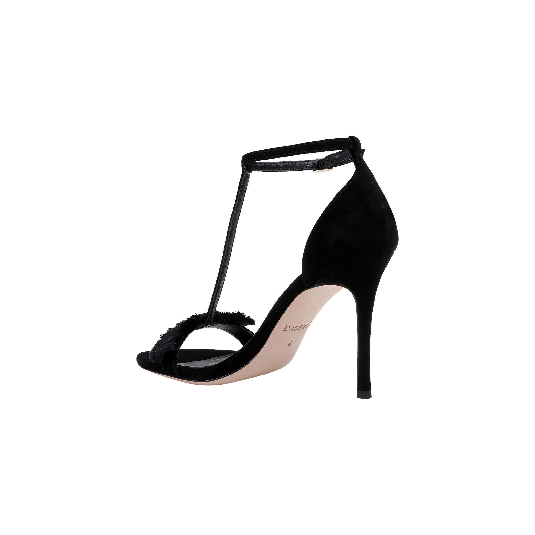 The Lerner Sandal is a black, suede T-strap sandal featuring a slim stiletto heel, open toe, and thin ankle strap, shown against a plain white background.
