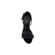 Top view of a single black Lerner Sandal with a suede upper, thin ankle strap, and gold buckle on a plain white background. The insole features the brand name LAREVICYE in gold lettering.