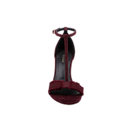 Front view of the Lerner Sandal in burgundy—a T-strap stiletto heel featuring an ankle strap and a fabric bow accent on the suede upper toe strap.