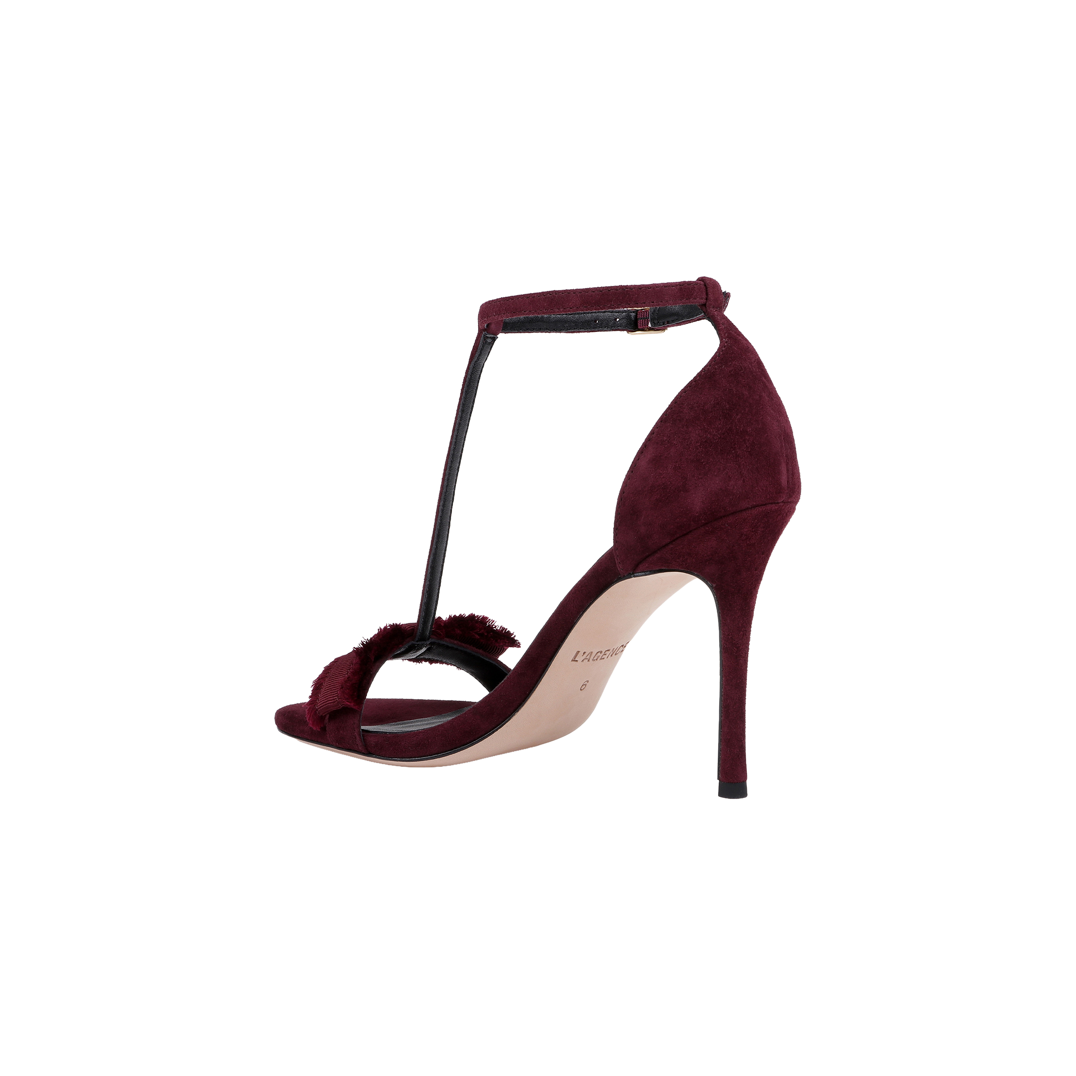 The Lerner Sandal features a burgundy suede upper with a stiletto heel, T-strap design, ankle buckle, and open toe, displayed against a plain white background.