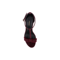 Top view of a single Lerner Sandal in burgundy, featuring a suede upper, ankle strap, and bow detail on the toe, displayed on a plain white background.