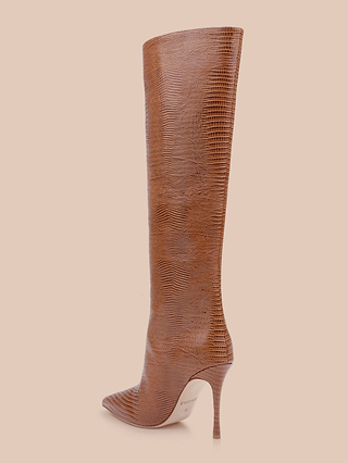 The Lafayette Boot is a brown knee-high, pointed-toe stiletto crafted from lizard-embossed leather, displayed in profile against a light beige background.