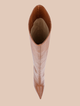 A top-down view of a single tall Lafayette Boot in brown with a pointed toe and stiletto heel, standing upright on a beige background.