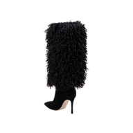 The Sheridan Boot features a pointed toe, stiletto heel, and shaggy black faux fur covering the shaft, offering bold style and luxe texture.